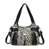 Tendencia transfronteriza moda femenina Y2K lavado desgastado chica hot estampado de leopardo bolso gran capacidad moderno multibolsillos bolso de hombro