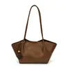 Bolso de hombro versátil, de lujo ligero, nicho, alta gama casual para mujer, nuevo modelo 2026, bolsa de mano tipo tote vintage de gran capacidad para el día a día