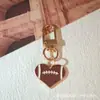 Producto Nuevo Transfronterizo Rugby Deportes Aleación Goteo de Aceite Belleza Evento Canadá y México Llavero Periférico Colgante Colgante para Bolso