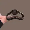 Pinza para el pelo acrílica hueca de diseño único para mujer, nuevo clip de tiburón popular otoño 2026, pinza de garra de peinado de alta gama