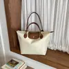 Bolso de Mano Estilo Coreano para Mujer 2026 Nuevo Diseño de Bloques de Color Bolso Tote para Mujer Moda de Nicho Bolso de Hombro de Gran Capacidad