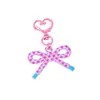 Llavero colgante de lazo estampado de estilo creativo y fresco con decoración de hebilla de puerta hueca en forma de corazón para DIY
