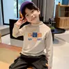 Ropa interior térmica para niños 2026 Nueva Ropa Otoño/Invierno Cuello Semi-Alto Camiseta de Manga Larga Cepillada para Niños Top Térmico de Felpa Tendencia