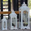Estilo europeo hierro retro romántico adornos de candelabro lámpara de viento a prueba de viento de pie soporte para velas accesorios de boda linterna guía de camino