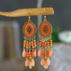 Pendientes de cuentas hechas a mano con forma de gota de agua transfronterizos Pendientes largos de borla Bohemia Joyería exagerada personalizada para fotos de viaje