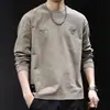 Camiseta de manga comprida com design jacquard estilo americano para homens, primavera e outono, gola redonda, marca da moda, top base estampado da moda
