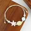 Jingdezhen Navidad Pulsera de Cuerda Trenzada de Cerámica Pulsera de Trébol de Cuatro Hojas Joyería Artística Hecha a Mano Venta al por Mayor Pulseras de Cerámica para Atracciones Turísticas