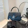 Bolsa Brilhante de Fio de Seda Versátil Feminina 2025 Versão Coreana Nova Bolsa de Mão Textura Exquisita de Luxo Leve Bolsa de Ombro