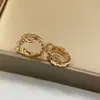 Versión Alta Pendiente Serpiente Oreja Baojia Moda Lujo Ligero Taladros Cabeza y Cola Dos Círculos Taladros Completos Artesanía de Precisión CNC Pendiente Serpiente de Temperamento Zodiaco