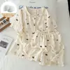 Estilo nuevo de verano, fresco y lindo, cuello redondo de encaje, estampado infantil, tela de algodón nube jacquard, cárdigan con almohadillas en el pecho, conjunto corto doble