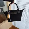 Bolsas de Alta Gama para Mujer 2025 Nuevo Estilo Simple y a la Moda Bolso Bandolera Bolso Dumpling Diseño de Nicho Versátil Bolso de Hombro Único Cruzado