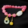 Pulseira Série Guofeng Mais Vendida Internacionalmente Cristal Rosa Diamante Colorido Bolsa da Sorte Fivela Ping An Lótus Rosa Bract Pulseira Artesanal para Mulheres