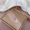 [Acero de Titanio] Lujo Ligero Micro-incrustado Oro Real Ojo de Gato Trébol de Cuatro Hojas Collar para Mujer Nueva Cadena de Arco Sentido de Diseño de Nicho de Lujo Ligero