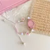 Pulsera de Cerámica con Perlas y Cuentas de Camelia Estilo Estudiante Nicho Simple Reloj de Cuarzo para Mujer con Acabado de Alta Gama, Nuevo Modelo 2025