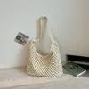 Bolsa de Palha Casual de Grande Capacidade para Mulheres 2026 Novo Estilo Bolsa de Ombro Vazada Estilo Preguiçoso Fashionável Elegante Bolsa de Praia para Férias