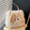 Bolsa de mão de desenho animado transfronteiriça para mulheres, novo estilo outono 2026, bolsa de ombro e transversal de pelúcia de nicho, moderna e versátil para meninas