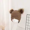 Gorro de punto para mujer con doble pompón, gorro cálido de lana para invierno, gorro para exteriores para curling, gorro de punto liso, venta al por mayor