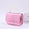 2025 Primavera e Verão Explosões Moda Casual Infantil Bolsa Doce Gelatina Mini Bolsa de Ombro Transversal de Mão Atacado