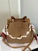 Bolso cubo muy elegante, nuevo bolso cruzado de moda otoño 2026, cadena de nicho sensación relajada bolso de mano de color liso