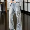 Jeans curvos estampados con patrón de rayo lavado retro americano para hombre, pantalones adelgazantes con vibra de alta costura, jeans de pierna recta acampanados