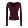 Ins Ropa de mujer estilo europeo y americano al por mayor 2026 Otoño Nuevo Estilo Temperamento Cuello en V Tejido de punto Manga larga Ajustado Camiseta básica