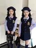 Conjunto escolar de uniforme JK estilo tailandés para niñas, nuevo conjunto de tres piezas de camisa, falda plisada y chaleco para niños de primavera y otoño, atuendo de otoño para niñas