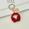 Llavero de Audífonos con Pedrería de Cristal Llavero Musical Completamente Cubierto de Pedrería Adorno Colgante de Cuerda de Diamante para Bolso Accesorios Llavero de Coche