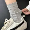 Calcetines florales retro para mujer, calcetines de algodón de otoño, calcetines blancos de moda estilo japonés hasta la mitad de la pantorrilla combinados con zapatillas de entrenamiento alemanas, calcetines holgados para otoño
