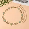 Cadena de cintura de mariposa de metal tallado para playa de verano combinada con una falda, cinturón bohemio vintage de alta gama de nicho al por mayor