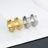 Pendientes de acero inoxidable de venta caliente transfronteriza personalidad de moda para hombres y mujeres mismos pendientes de acero de titanio color acero pendientes de oro de 18 quilates cierre de oreja