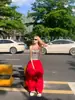 Pantalones casuales de pierna ancha plisados estilo retro americano para mujer, nuevo modelo de verano, versátiles, holgados, casuales, cintura elástica, hasta el suelo