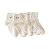 Nuevos calcetines de otoño de hilo de lunares hasta la mitad de la pantorrilla, absorbentes de sudor y resistentes al olor, hechos de algodón de Xinjiang, con lindos diseños de dibujos animados, calcetines para estudiantes al por mayor