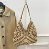 Bolsa tejida popular de celebridad de internet de gran capacidad para mujer 2026 Verano Nuevo Bolso de hombro único de paja Informal Bolso de playa para el mar