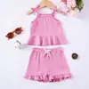 En stock Ropa de verano explosiva transfronteriza para bebé niña, conjunto de tirantes, color liso, sin mangas para recién nacido, pantalones cortos con volantes, ropa casual para niños