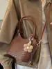 Bolsa de cubo de mano Shuai Mi Jia estilo coreano ins de moda para mujer, nuevo modelo de principios de otoño 2026, bolso de hombro simple y elegante, bolso de cubo