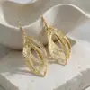 Pendientes de hoja multicapa de metal hueco transfronterizo con gotas de agua de viento nacional retro, pendientes de borlas geométricas redondas al por mayor