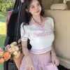 Top corto de estilo universitario para compañero de escuela de verano con falda plisada, diseño chic único, manga corta de seda helada