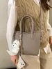 Bolso Cubo de Mano Estilo Coreano de Nicho para Mujer 2026 Modelo Nuevo de Primavera Textura de Alta Calidad Bolso Cruzado de Hombro Casual Súper Popular