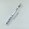 Cuchara y tenedor florales de fruta con mango de cerámica creativa, cuchara de postre de acero inoxidable 410, cuchara para remover café, cuchara y tenedor para el té de la tarde