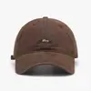 Gorra de béisbol de ala curva y copa suave para hombres y mujeres, estilo coreano de verano, nueva gorra casual versátil con bordado de letras que hace que la cara parezca más pequeña