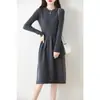 Vestido de punto de lana pura con cuello redondo hueco y falda plisada para mujer, nuevo para otoño e invierno, suéter, falda hasta la rodilla, falda base