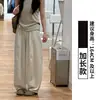 Calça larga de seda gelo texturizada cor verde cinza para mulheres, novo estilo de verão 2026, cintura alta, fluida, casual, versátil, calça banana
