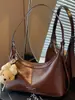 Bolso de mano para mujer Shuai Mi Jia 2026 nuevo de principios de otoño, bolso vintage para hombro o axila, bolso cruzado de alto valor para el día a día
