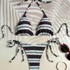 Nuevo bikini triangular retro a rayas de estilo europeo y americano con cordones laterales y diseño de corte alto, perfecto para vacaciones en la playa