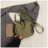Bolso bandolera de hombro único de estilo coreano para comercio exterior, bolso de cubo fresco con cordón para mujer, bolso de hombro pequeño casual de nailon texturizado transfronterizo