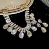 Conjunto de Pendientes y Collar Ovalados con Forma de Gota de Agua Incrustados de Diamantes, Exquisita Cadena para Clavícula de Moda Europea y Americana, Joyería de Lujo Ligero y de Alta Gama para Mujeres