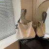 Bolsa Tote Listrada de Grande Capacidade Transfronteiriça para Mulheres 2026 Nova Bolsa de Ombro Versátil Estilo Preguiçoso Nicho Bolsa de Ombro para o Dia a Dia
