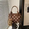 Moda fuente de fábrica transfronteriza 2026 nuevo diseño de lunares en nailon bolso de mano casual para el día a día bolso de hombro tipo cubo