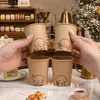Taza desechable estilo ins engrosada comercial patrón de dibujos animados taza de papel para el hogar taza de leche de soja cara sonriente taza de agua al por mayor