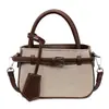 Bolso de Mano Patchwork Retro para Mujer 2026 Nuevo Bolso Cruzado de Hombro Único para el Trabajo Diseño de Nicho Versátil Bolso Cubo